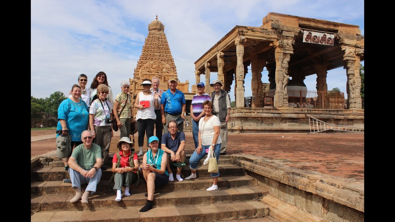 International travelers at Brihadisvara Temple, Thanjavur — the temple welcomes visitors of all backgrounds and nationalities into its sacred courtyard